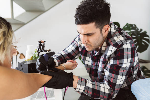 istock young tattooist man tattooing from home 1372384324