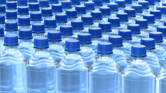 Rows of plastic bottles of clear purified drink carbonated water with blue caps. 3D illustration