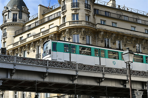 Paris, France-02 23 2022: Subway train passing on a bridge in Paris, France.