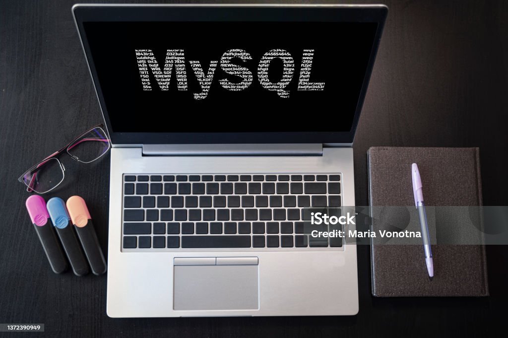 Top view of laptop with text MySQL. MySQL inscription on laptop screen and keyboard. Learn MySQL language, computer courses, training. Network Server Stock Photo