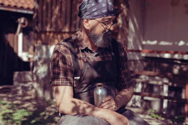 istock Spoon master in his workshop with wooden products and tools 1372396649