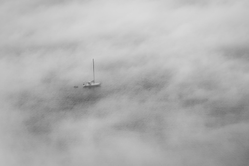A thick fog descended over the water