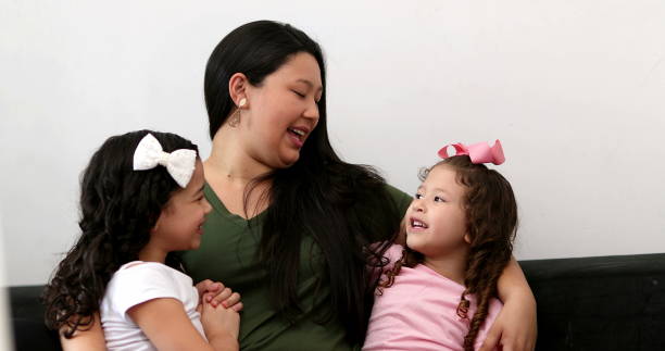 istock Asian mom with hispanic mix children interaction 1372398297