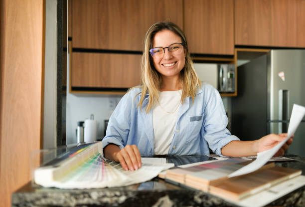 istock Smiling young interior designer going over swatches in a customer's kitchen 1372401346