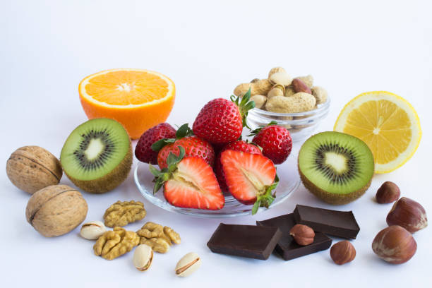 istock Allergens berry, fruit and nuts on the white background. Close-up. 1372401643