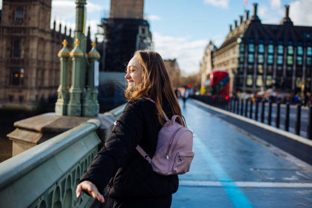 istock Woman having fun on Westminster Bridge 1372407971