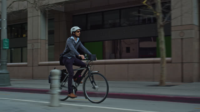 E-Bike Commuter Turning Onto Street with Bicycle Lane