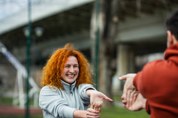 istock Beautiful female athlete stretching before outdoor workout 1372409289