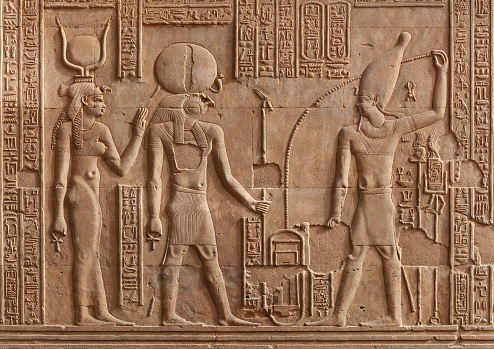 Ancient relief with Ra God and Hathor Goddess of Kom Ombo temple in Aswan Governorate, Upper Egypt. It was constructed during the Ptolemaic dynasty, 180–47 BC