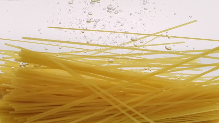 Pasta Splashing into Water in Slow Motion