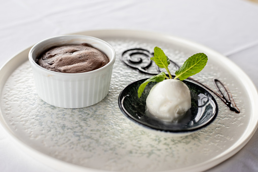 Chocolate souffle served with vanilla ice cream