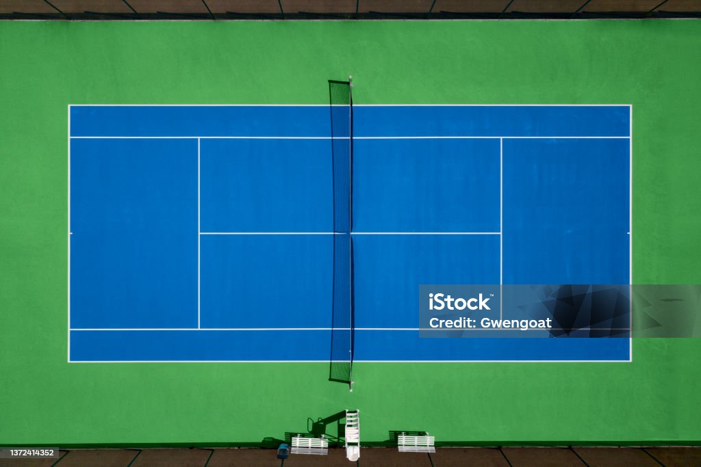 Aerial view of a tennis court Aerial view of blue and green tennis hard court. High Angle View Stock Photo