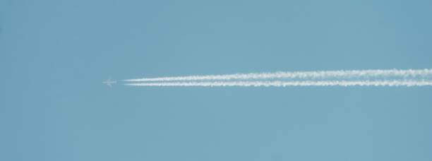 istock White trail from a flying plane 1372414386