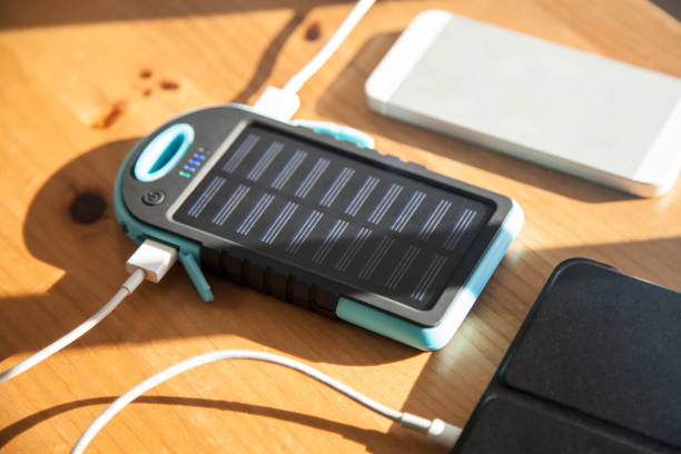 istock Solar power bank unit charging tech devices smart cellphone and tablet 1372421548