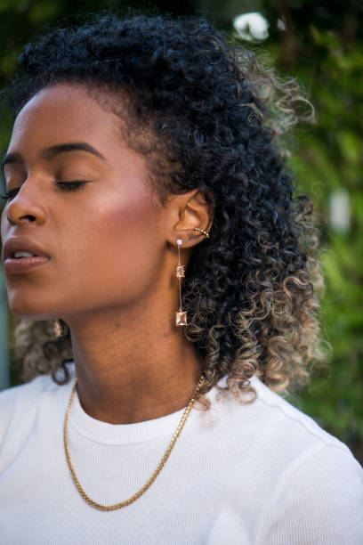 Gold earrings of different sizes and shapes. Retro photo