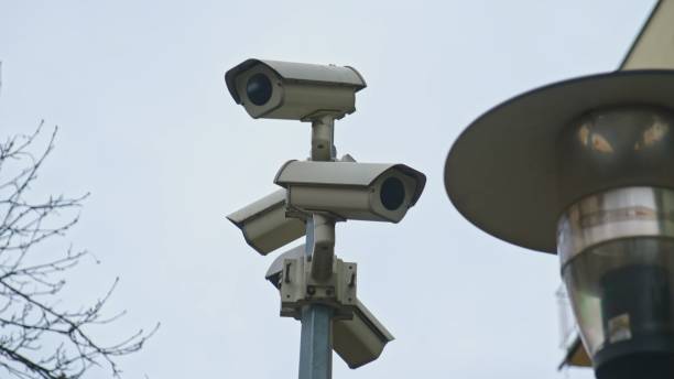 istock Multiple Street Survillance Security CCTV Cameras Installed in Residential Area 1372424083