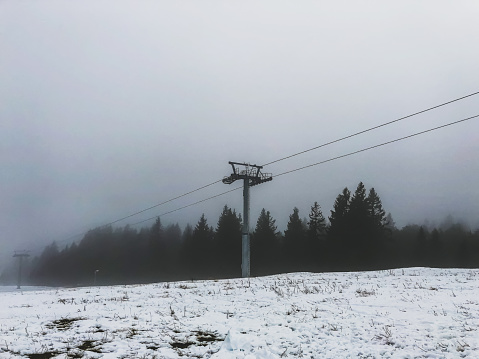 A cable hoist on a mountain in the Black Forest in snow.