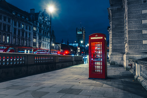 A view of a telephone red box on a street