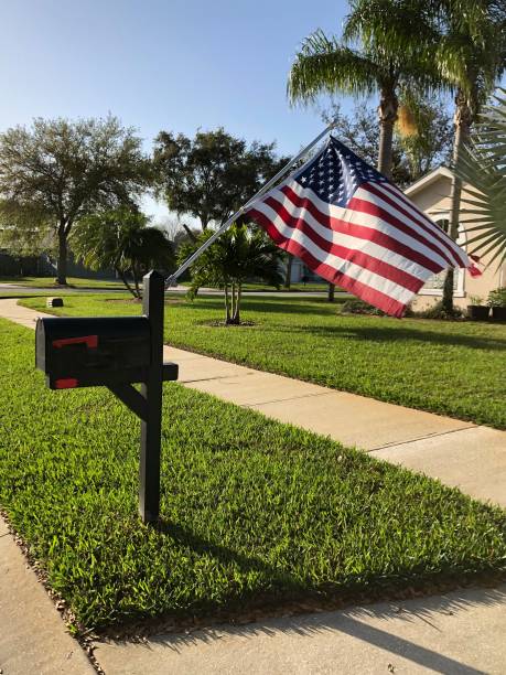 istock American flag waving in breeze mounted on  rural mailbox post 1372440942