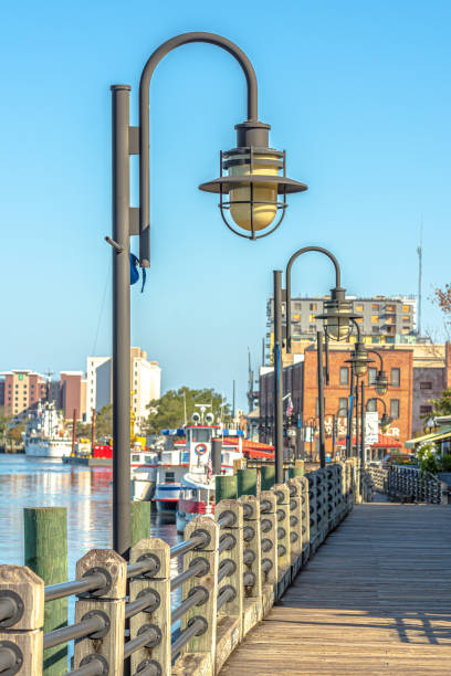 Wilmington,NC Riverwalk along the waterfront of the Cape Fear River in the morning. wilmington north carolina stock pictures, royalty-free photos & images