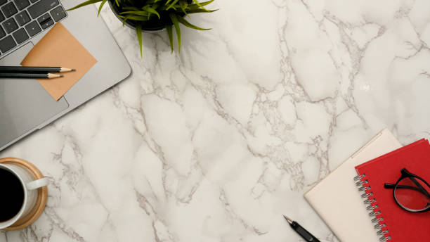 istock Marble office desk workspace background with copy space and office accessories 1372450207