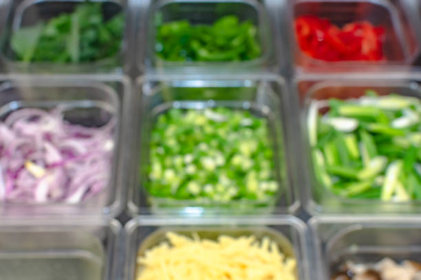istock Blurred background. Pieces of vegetable in clear container. 1372451118