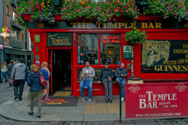 People hanging around the famous Temple Bar in Dublin, Ireland