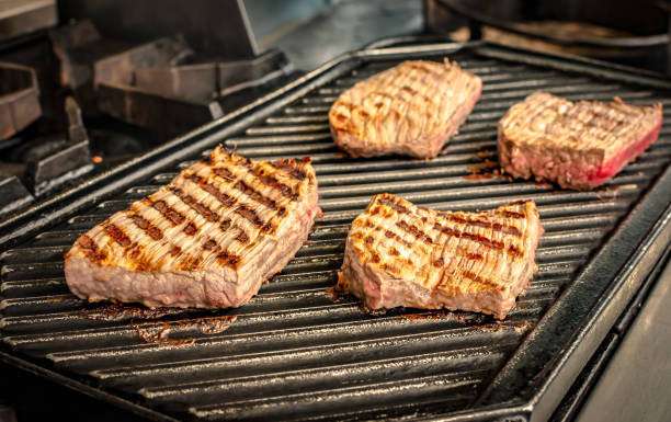 istock Grilling steak on the grill 1372453724