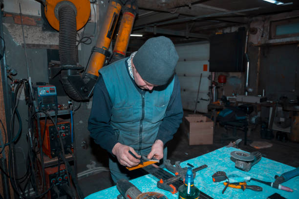 istock The locksmith marks the stainless profile pipe with a square 1372455555