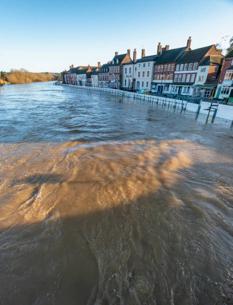 istock Critically high river waters flowing through Bewdly Bridge,protected by flood defence barriers,Bewdley,Worcestershire,England,UK. 1372456391