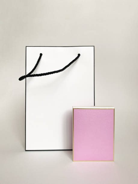 istock Perfume bottle from a pink box on a white isolated background 1372463344