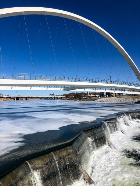 istock Single arch pedestrian bridge in Iowa 1372463471
