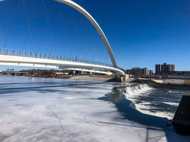 istock Single arch pedestrian bridge in Iowa 1372463497