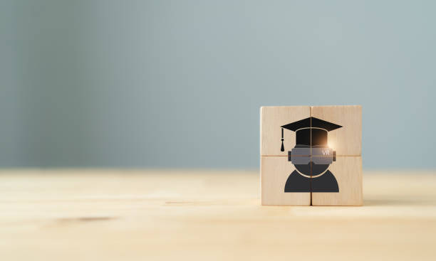 istock Virtual reality (VR) education concept. Futuristic school science class for children learning in STEM Programs. Wooden cubes with chldren using virtual reality headset  for education icon. 1372466013