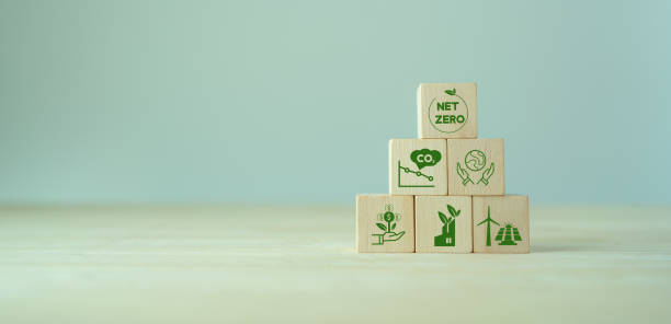 istock Net zero and carbon neutral concept. Net zero greenhouse gas emissions target. Climate neutral long term strategy. The wooden cubes with green net zero icon and save world icon on grey background. 1372466075