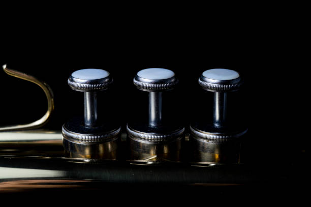 istock Brass instruments, golden trumpet in the dark 1372468160