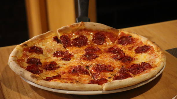 istock Pepperoni Pizza in an Italian Restaurant 1372468163