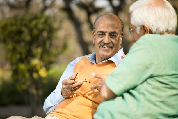 istock Two senior men discussing at park 1372469195