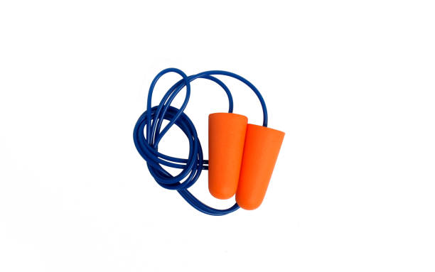 Photo of orange corded earplug Earplug that function as ear protection from loud and noisy sounds. Many workers use this tool while working as their ear protection. this is part of safety first ear plug stock pictures, royalty-free photos & images