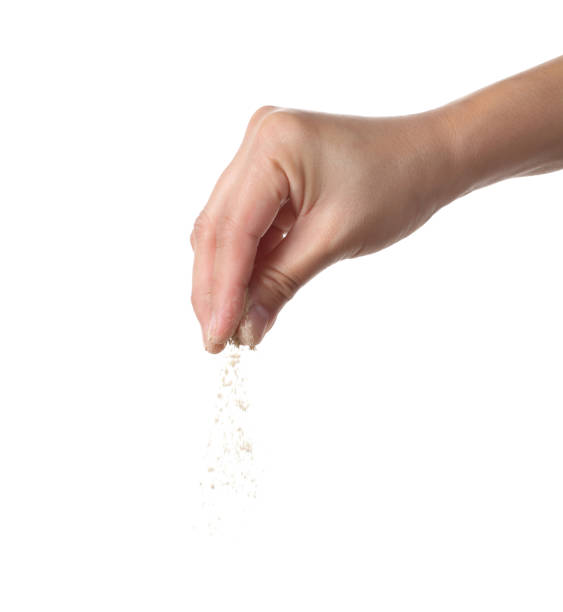 istock Hand holding ground pepper on white background 1372471235