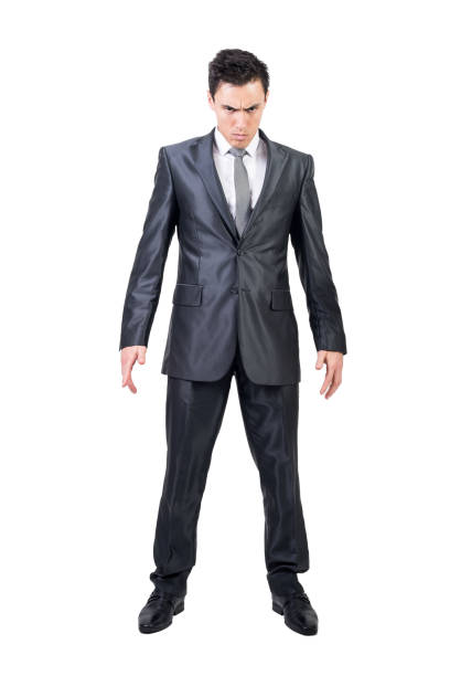 istock Serious man in elegant suit. White background. 1372473353