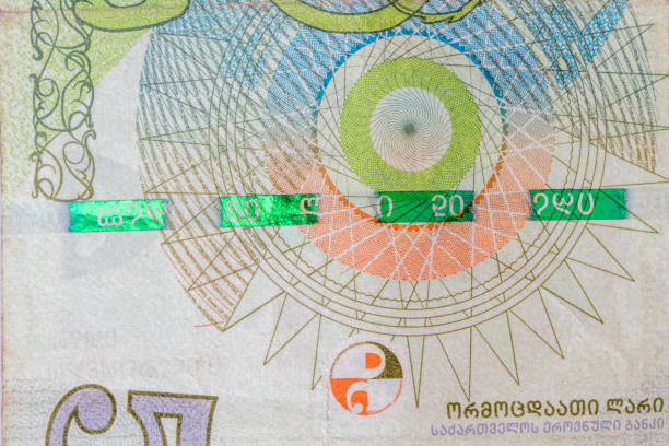 istock Plastic security strip on 50 GEL banknote. Security strip on Georgian lari banknote created to prevent counterfeiters. 1372474293