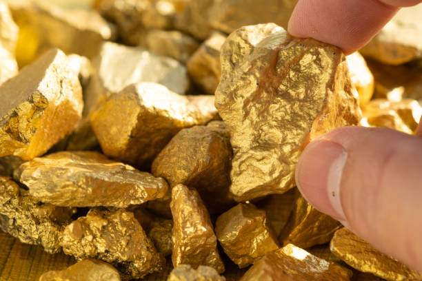 istock lump of gold ore from gold mine texture background 1372474510