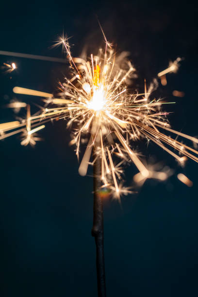 istock Christmas bengal fire sparkles against the black background. 1372475390