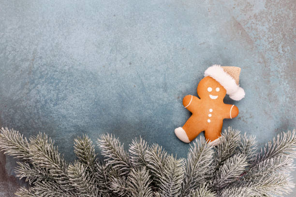 istock Gingerbread man, cookies and Christmas decor on pastel background. 1372475596