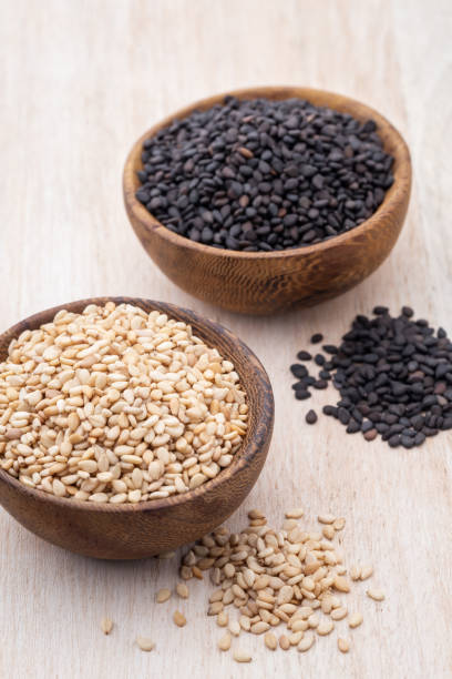 istock White sesame and black sesame seed on wooden bowl. 1372477222