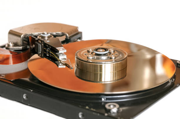 istock Disassembled hard disk drive close-up isolated on white background. 1372478486