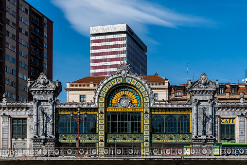 Bilbao, Spain - February 13, 2022: Bilbao-Concordia railway station on the riverside of the estuary of Bilbao.