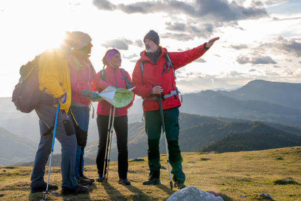istock Man showing direction to his friends 1372478565