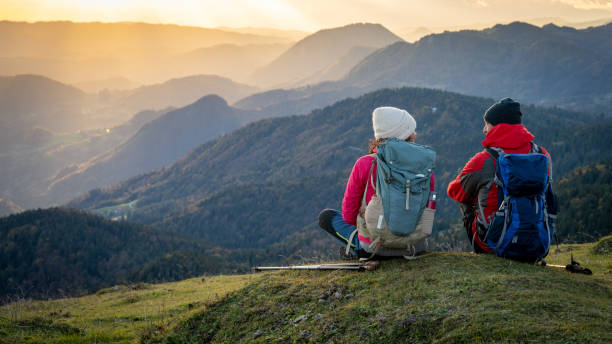istock Couple talking with each other on mountain top 1372478597
